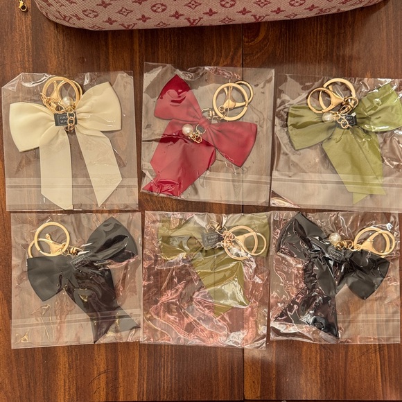 Accessories - 2 Bag Bow Charm with gold accent one green and one white left